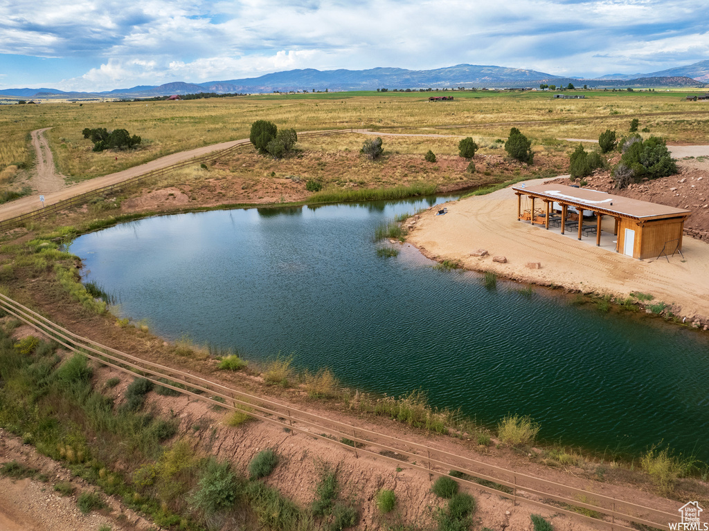 Bird's eye view with a rural view and a water and mountain view