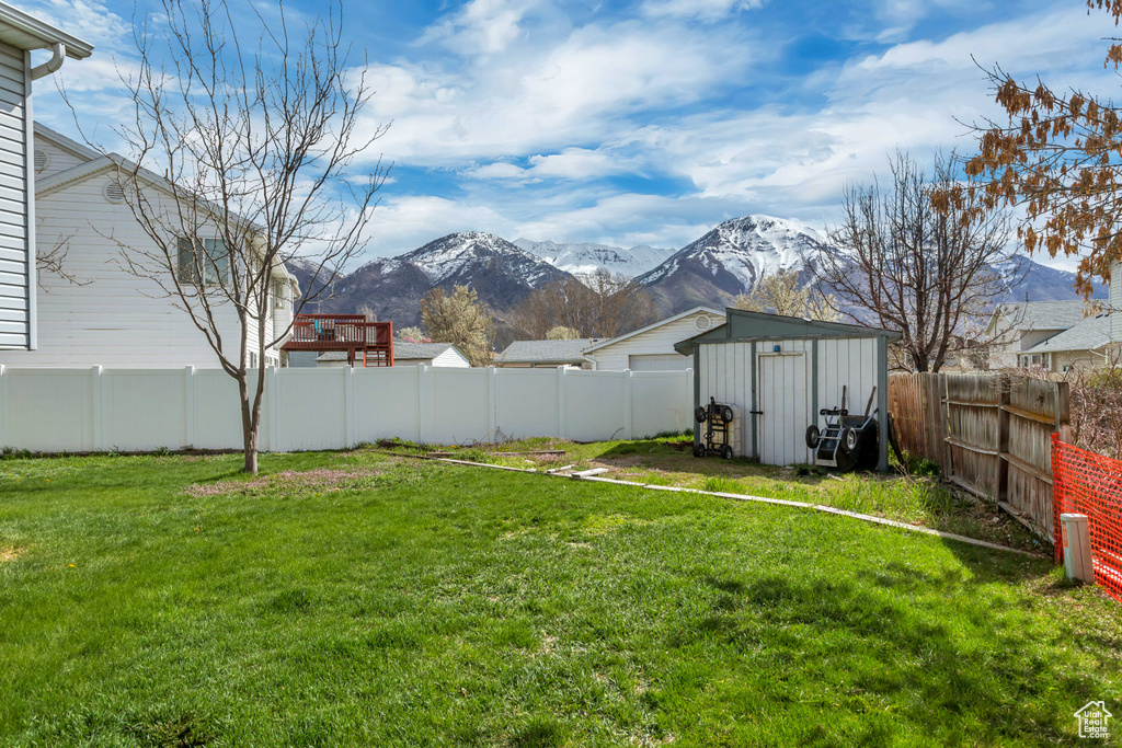 View of yard featuring a shed and a mountain view