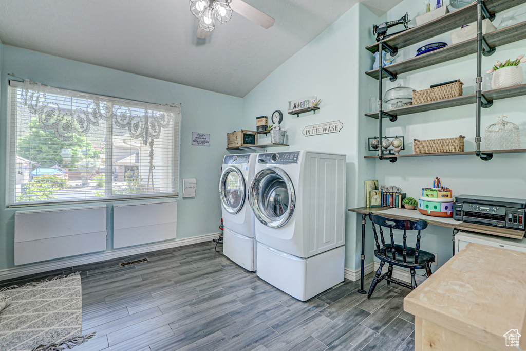 Laundry room featuring ceiling fan, hardwood / wood-style floors, and separate washer and dryer