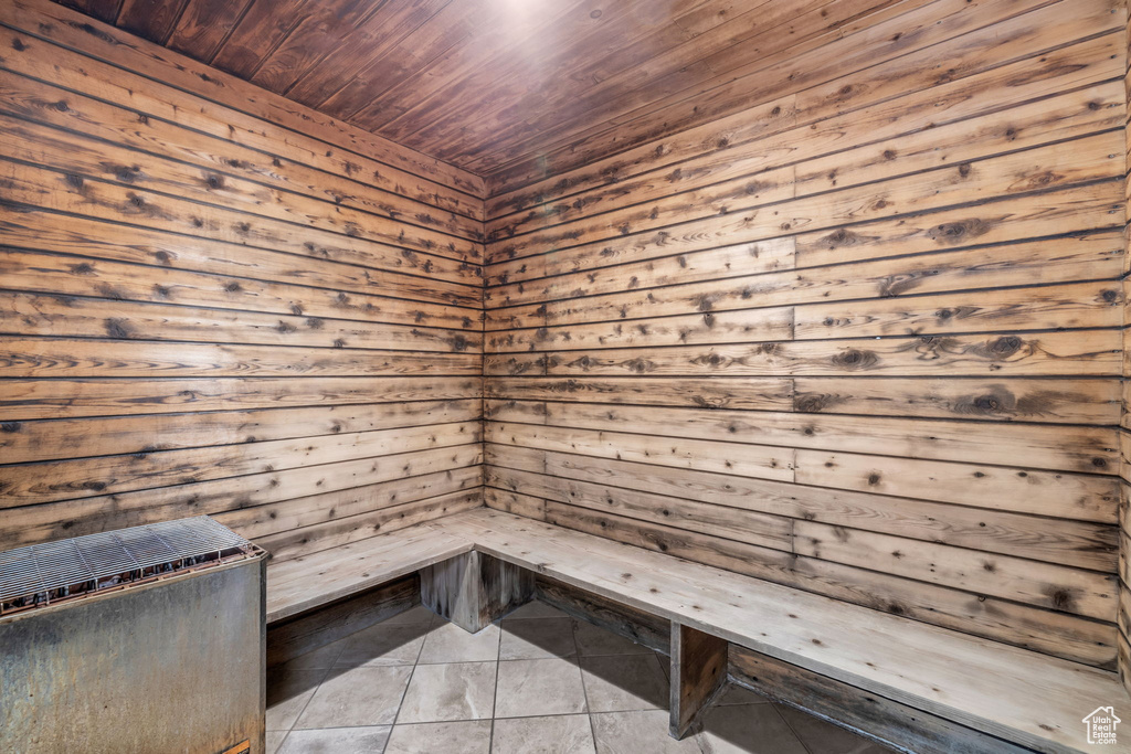 View of sauna featuring wood ceiling and tile flooring