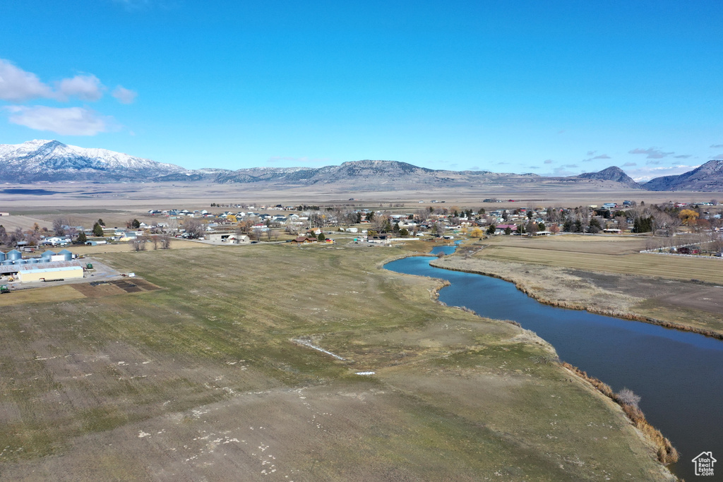 Aerial view featuring a water and mountain view