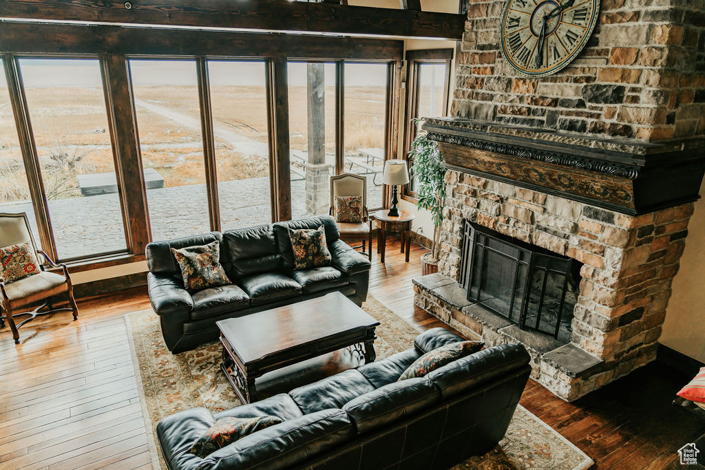 Living room featuring dark hardwood / wood-style flooring and a fireplace