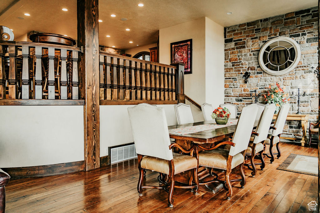 Dining room with hardwood / wood-style flooring