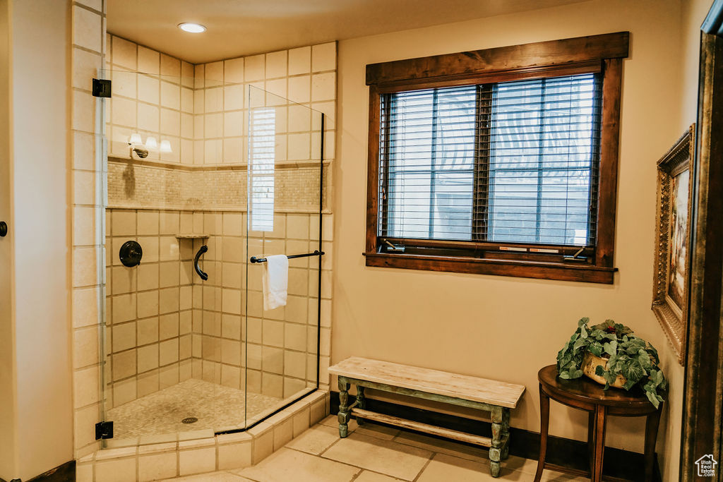 Bathroom featuring tile floors and walk in shower
