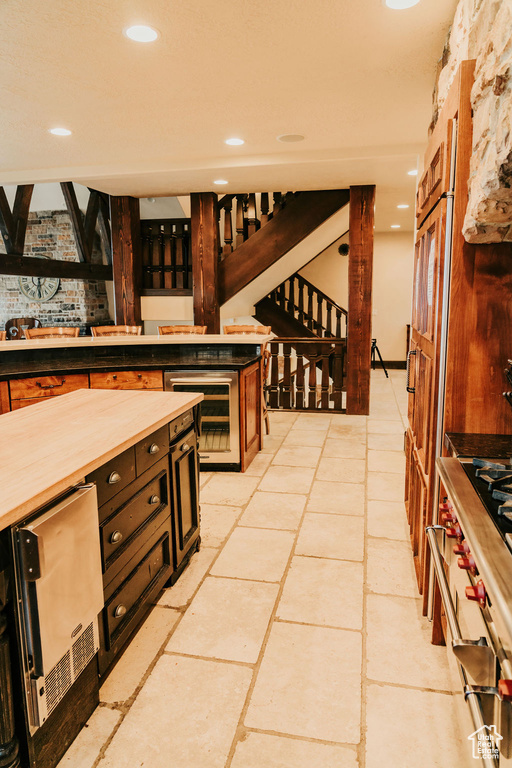 Kitchen featuring light tile floors and wine cooler