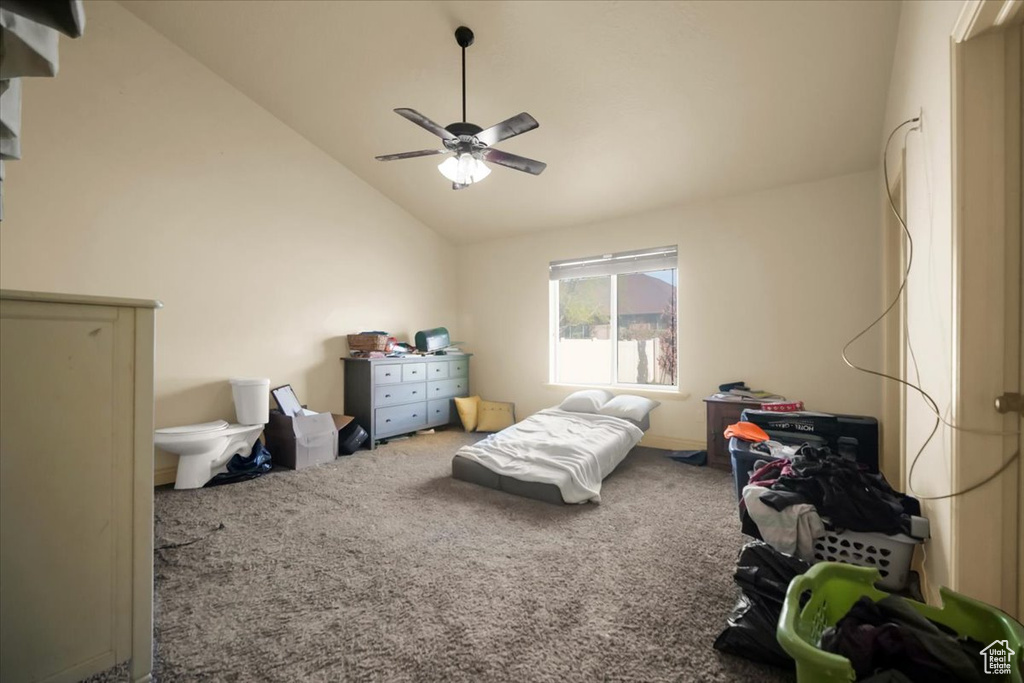 Bedroom featuring ceiling fan, carpet floors, and high vaulted ceiling