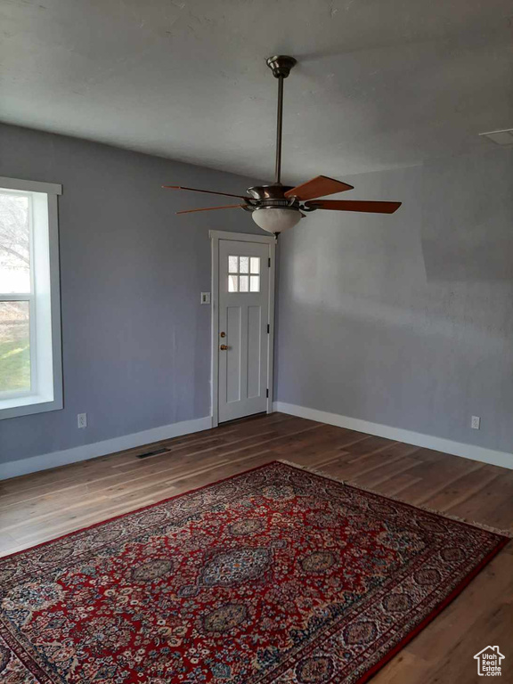Foyer entrance featuring ceiling fan and light hardwood / wood-style floors