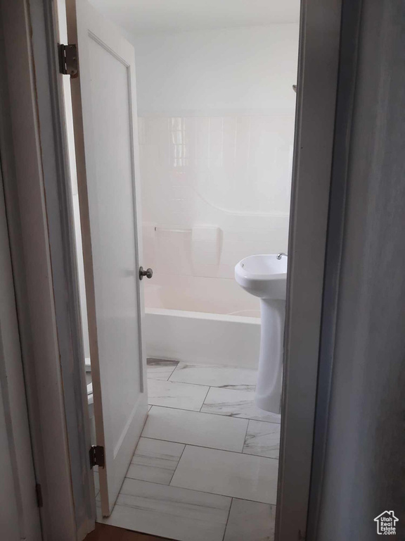 Bathroom with  shower combination and tile flooring
