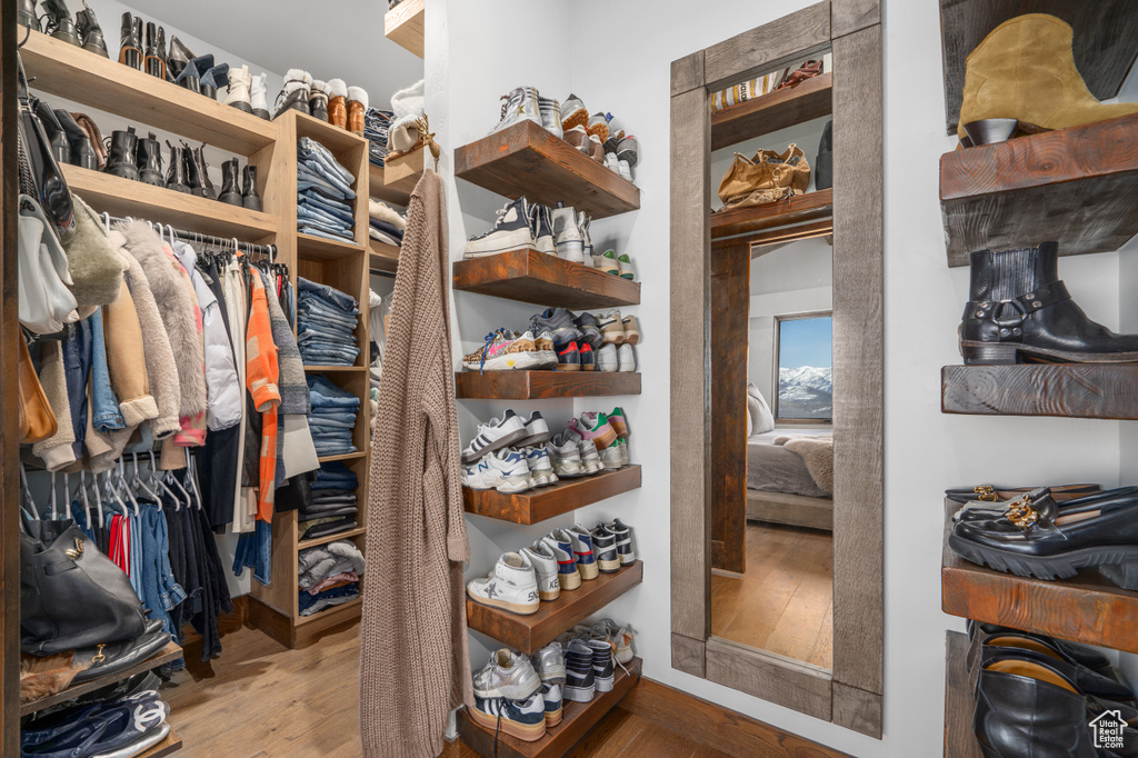 Walk in closet featuring light wood-type flooring