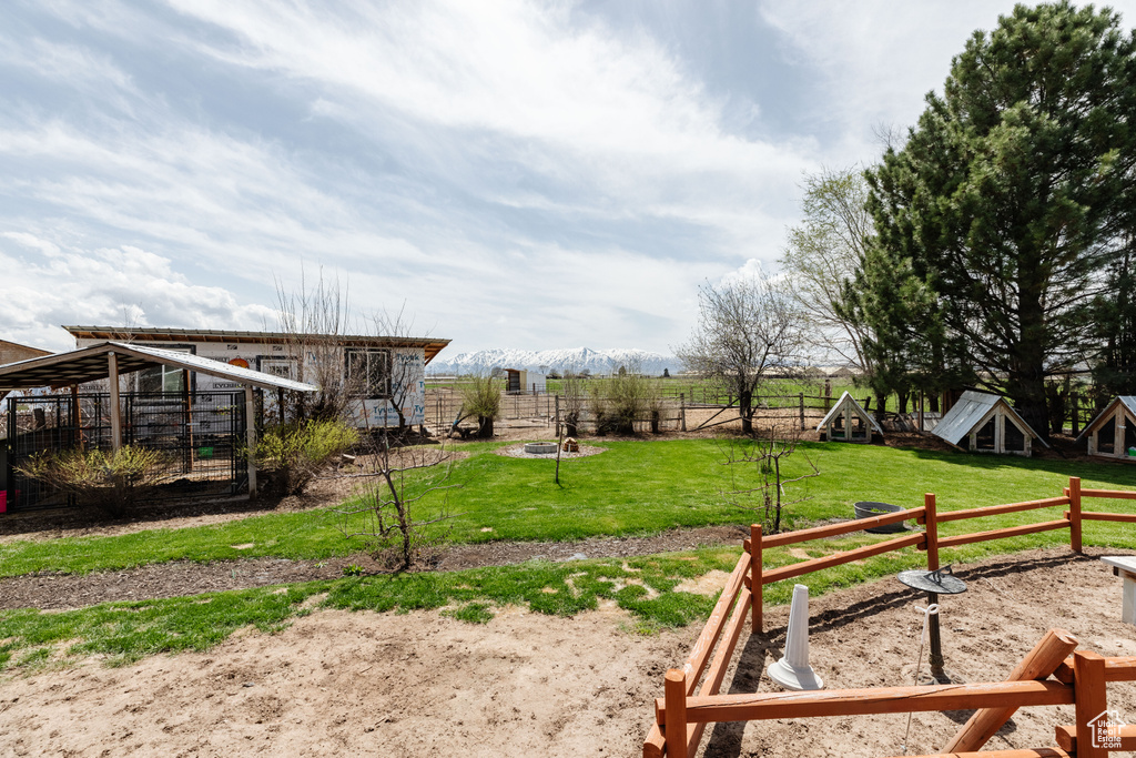 View of yard with a rural view and a playground