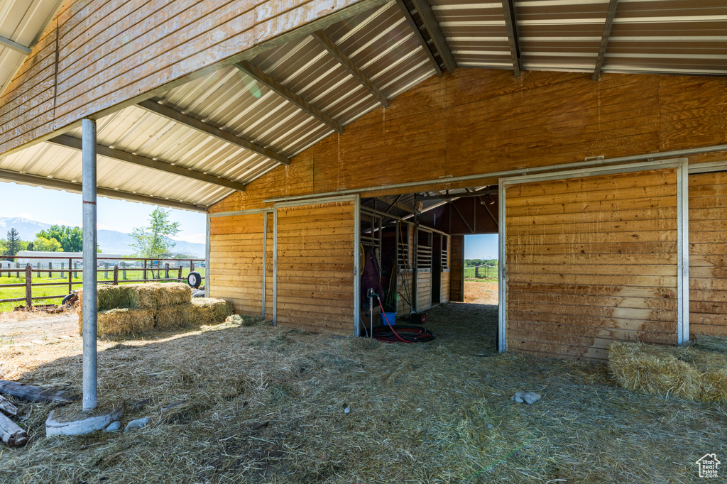 View of horse barn with an outdoor structure