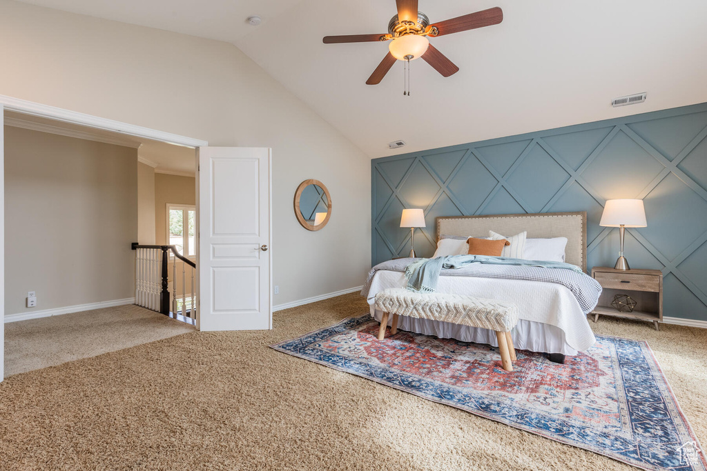 Bedroom featuring ceiling fan, light colored carpet, and high vaulted ceiling
