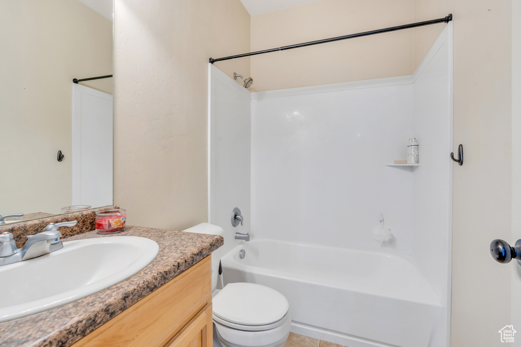 Full bathroom featuring vanity, tile floors, shower / bathing tub combination, and toilet