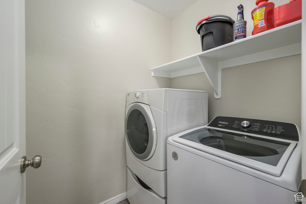 Laundry room with washing machine and clothes dryer