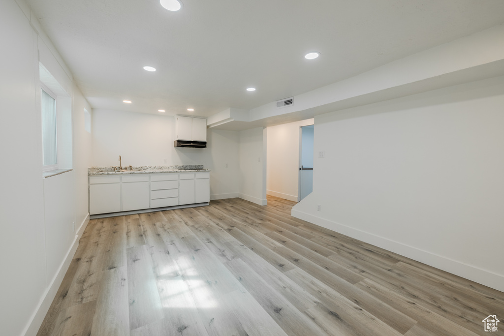 Interior space featuring sink and light hardwood / wood-style flooring
