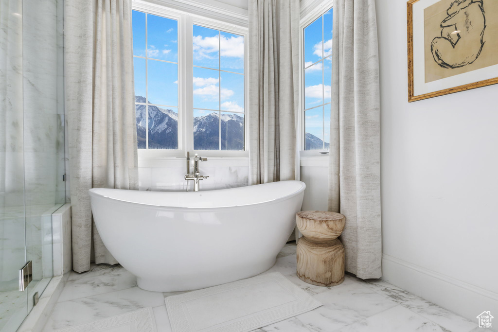 Bathroom with tile flooring and a mountain view