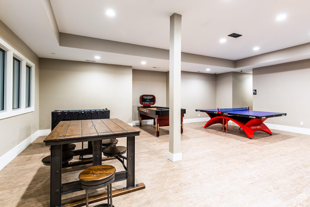 Recreation room with a tray ceiling