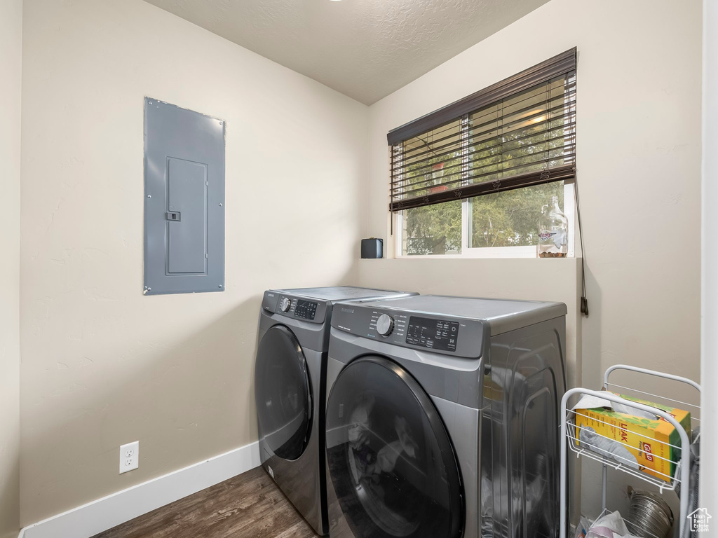 Laundry room featuring dark hardwood / wood-style flooring and separate washer and dryer