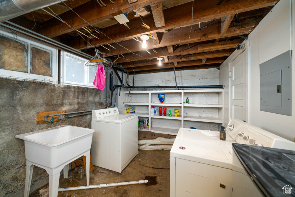 Basement with separate washer and dryer and sink