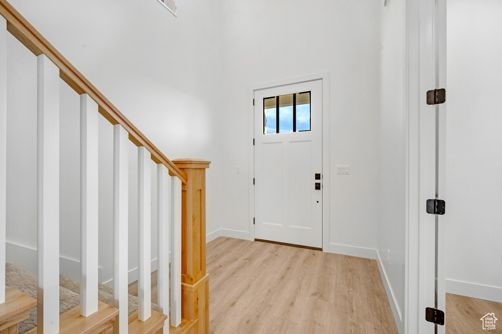 Entrance foyer featuring light hardwood / wood-style flooring
