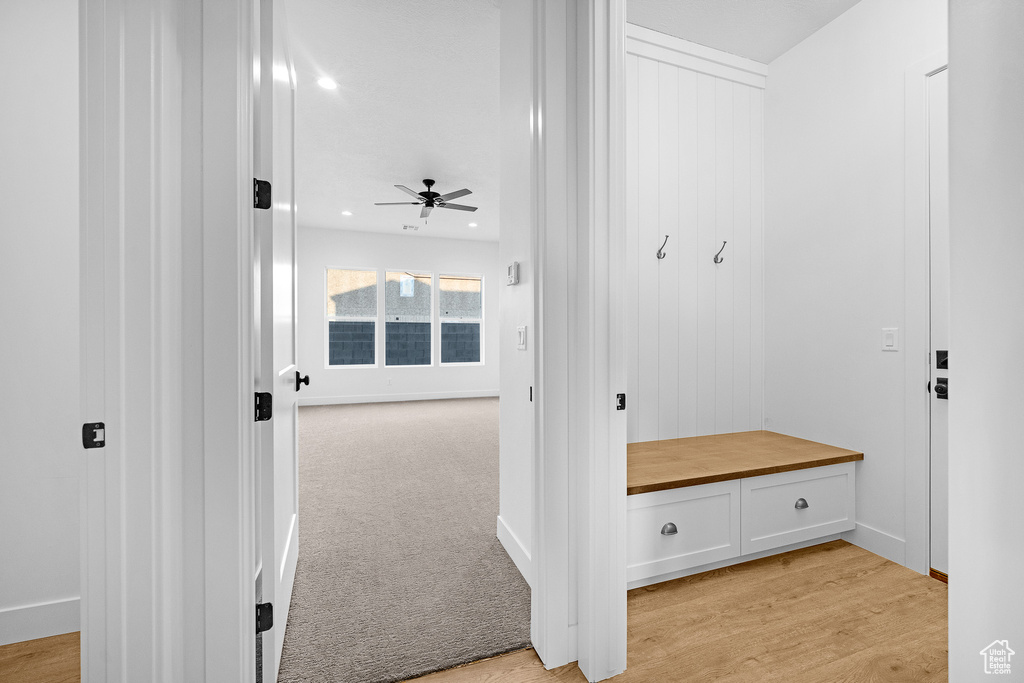 Mudroom with ceiling fan and light wood-type flooring