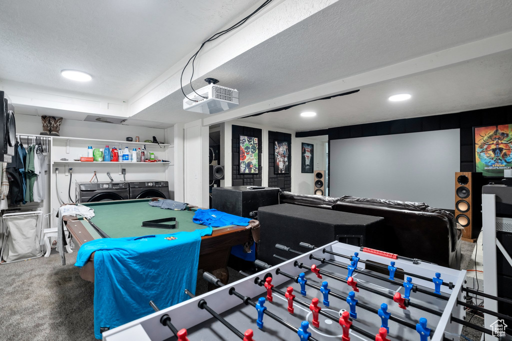 Rec room featuring carpet flooring, washer and clothes dryer, billiards, and a textured ceiling