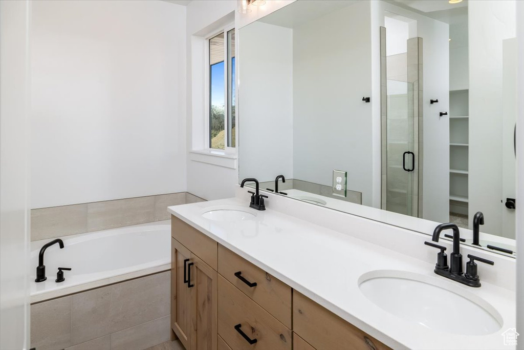 Bathroom with dual vanity and separate shower and tub