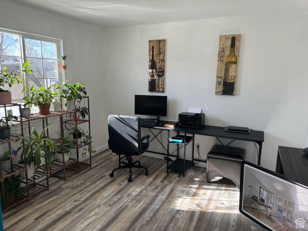 Office area with dark wood-type flooring
