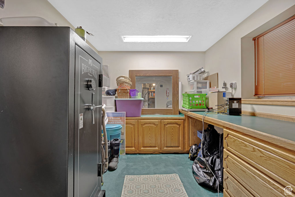 Kitchen featuring light colored carpet