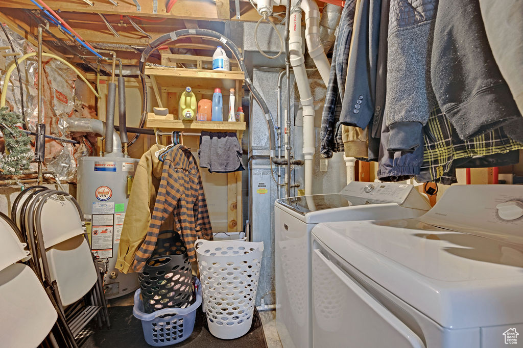 Interior space with water heater and washer and clothes dryer
