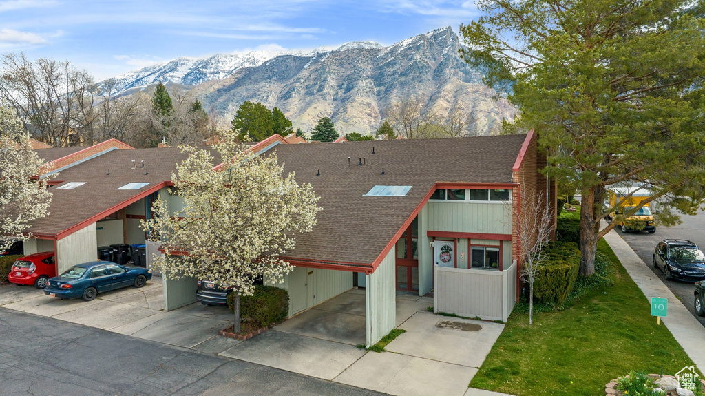 View of front of house featuring a mountain view and a carport