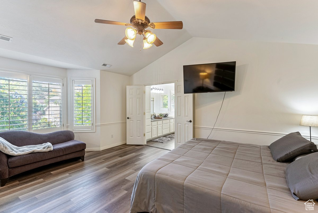 Bedroom featuring lofted ceiling, light hardwood / wood-style floors, and ceiling fan