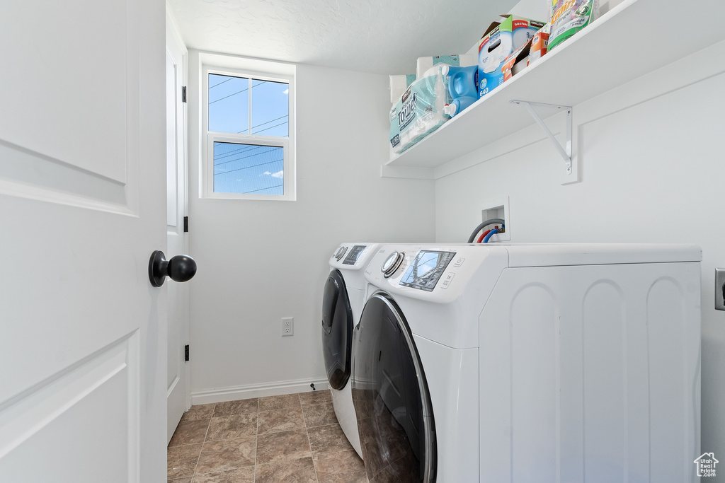 Laundry area featuring independent washer and dryer, washer hookup, and light tile flooring