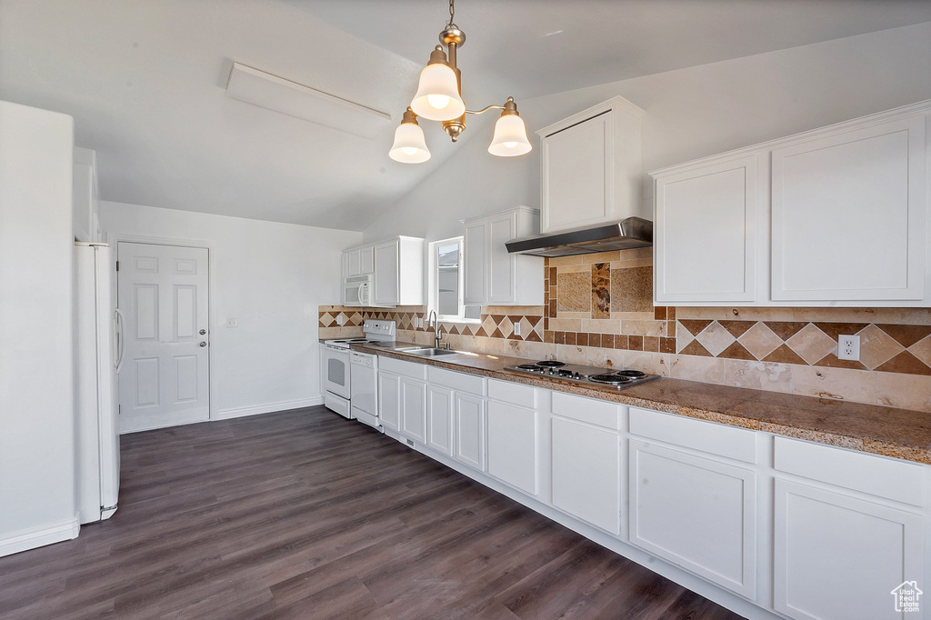 Kitchen featuring pendant lighting, white appliances, sink, dark hardwood / wood-style floors, and white cabinets