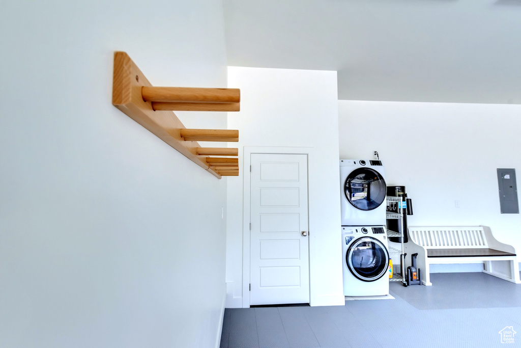 Interior space featuring stacked washing maching and dryer