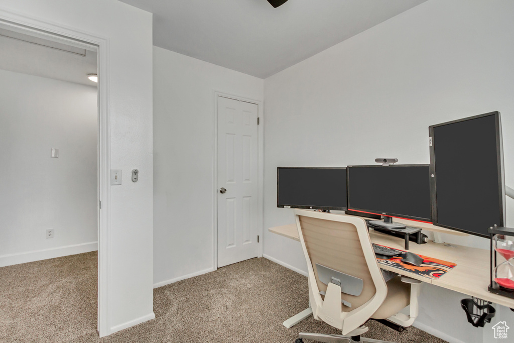 Home office featuring light carpet