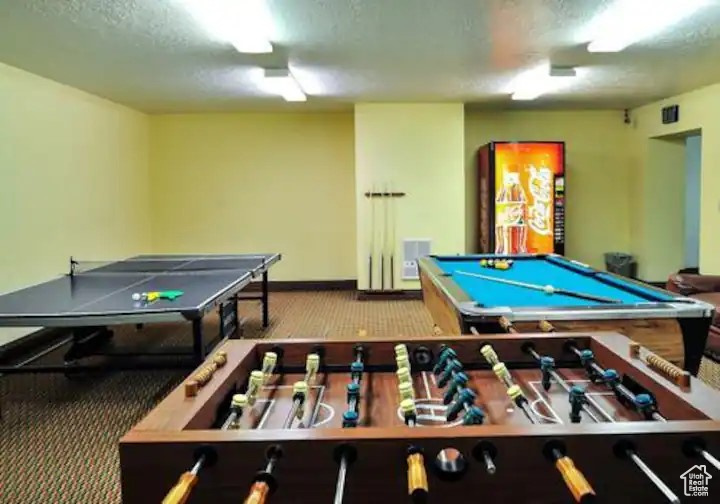 Rec room with carpet floors and pool table