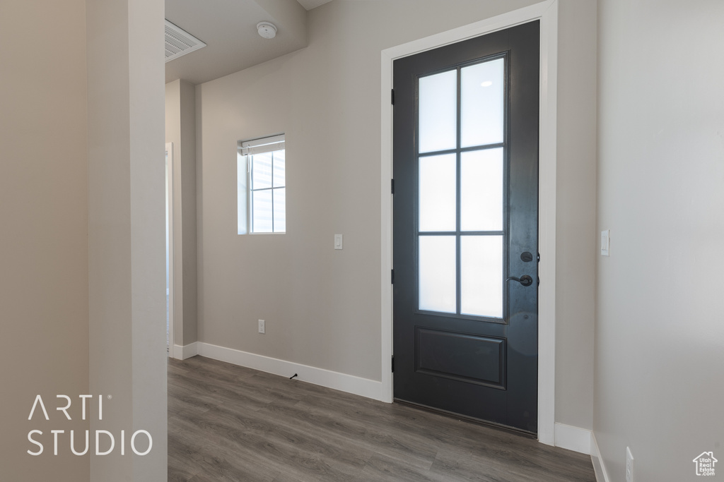 Doorway to outside with hardwood / wood-style floors