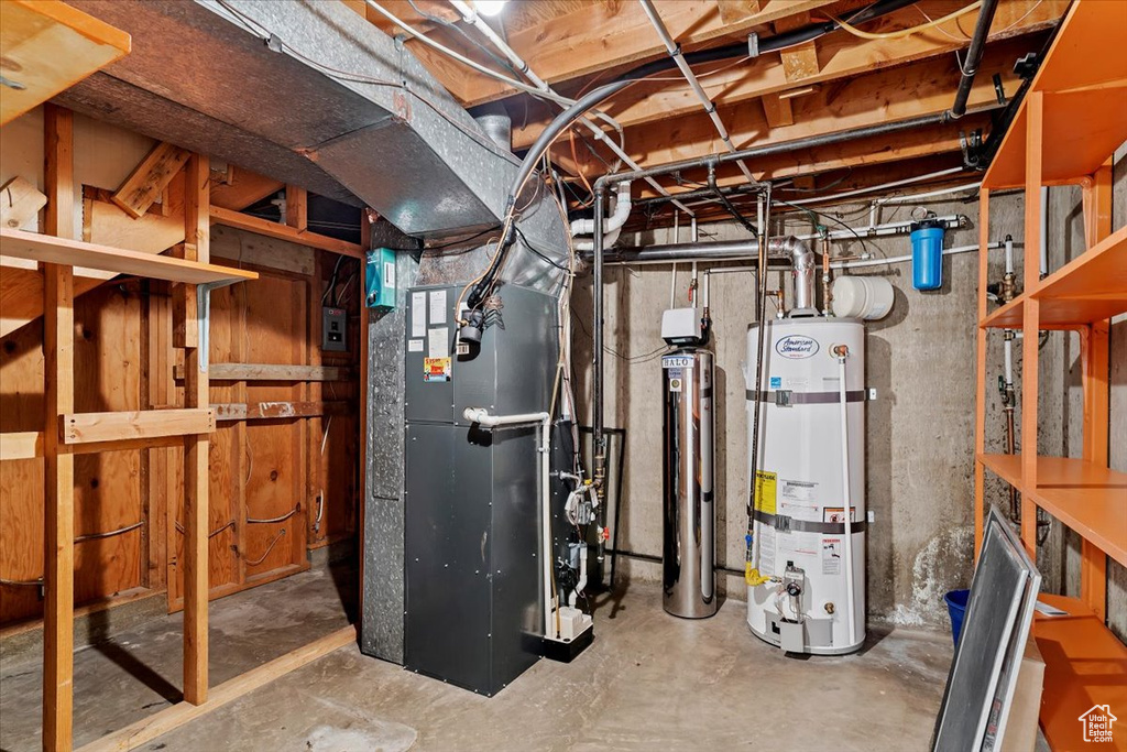 Utility room featuring heating utilities and secured water heater