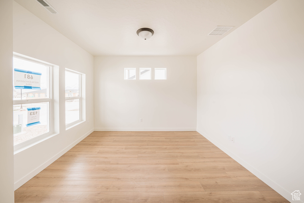 Empty room with light wood-type flooring