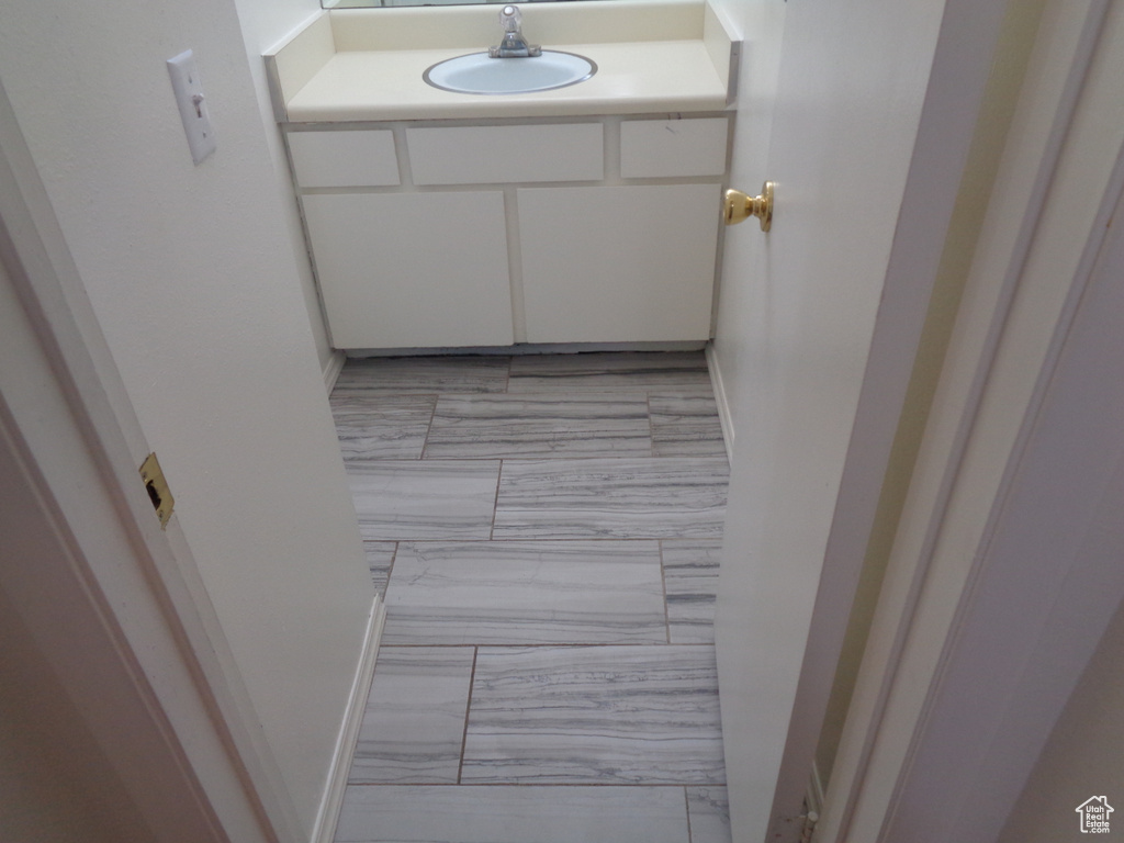 Bathroom with vanity and tile floors