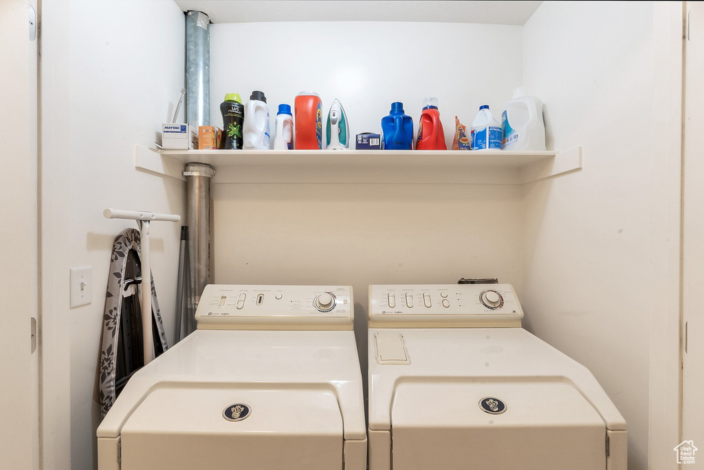 Washroom with washing machine and clothes dryer