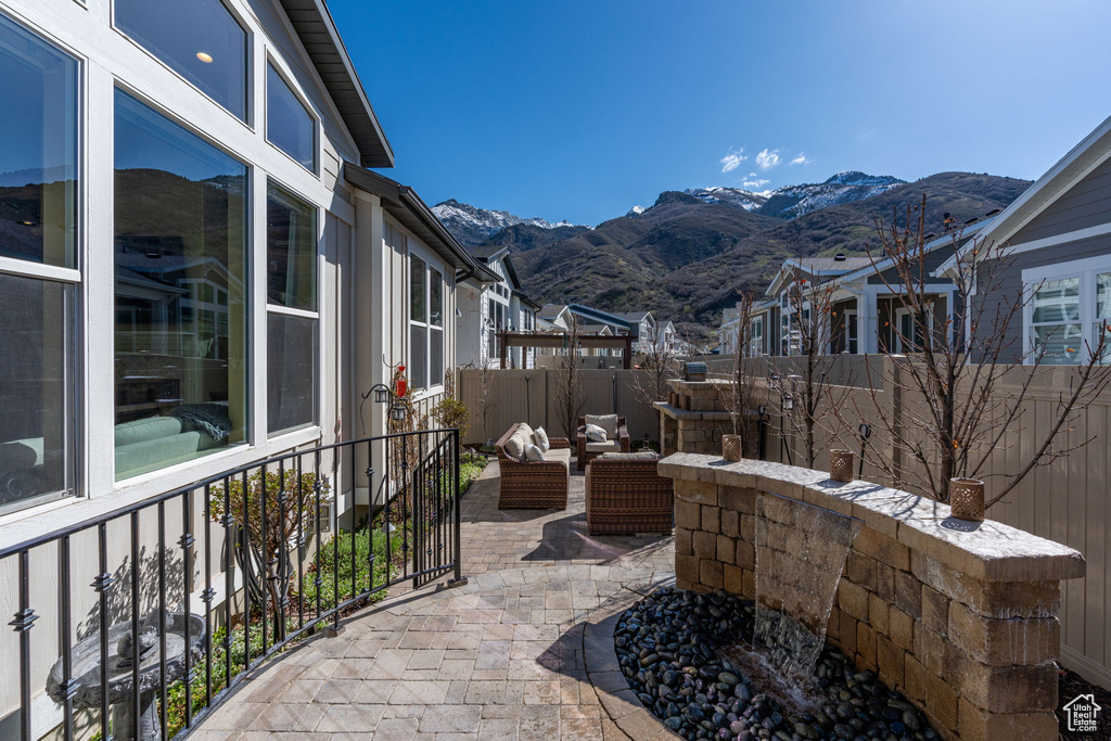 View of patio with a mountain view and an outdoor living space