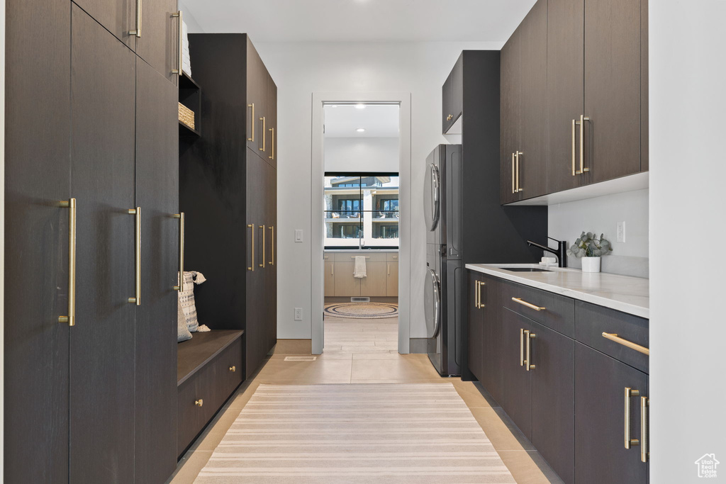 Kitchen featuring dark brown cabinets and sink