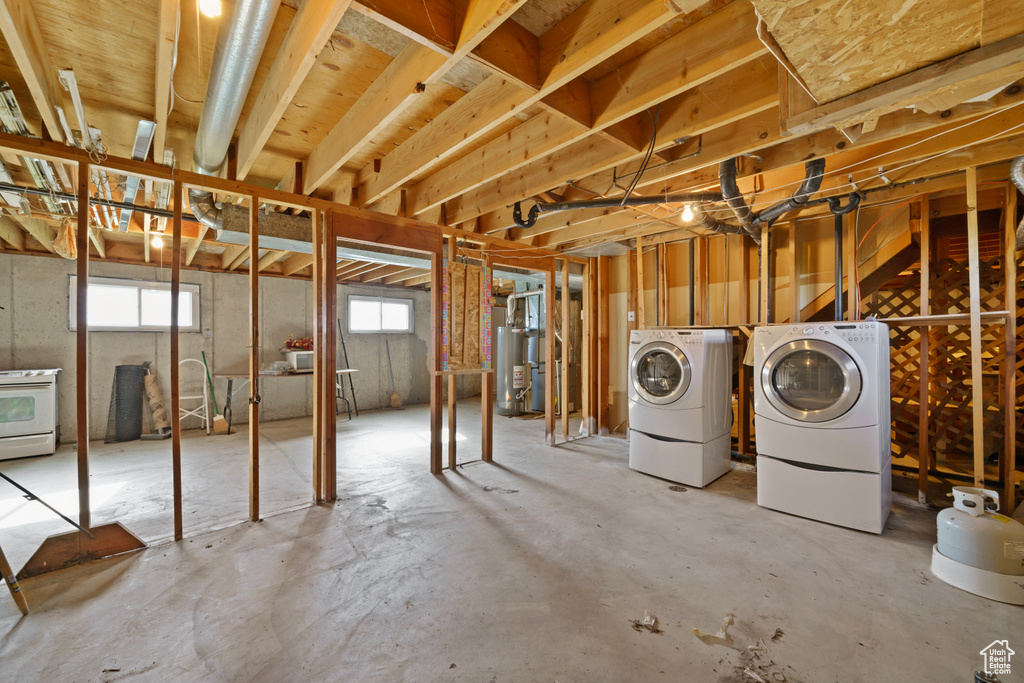 Basement with washing machine and dryer and gas water heater
