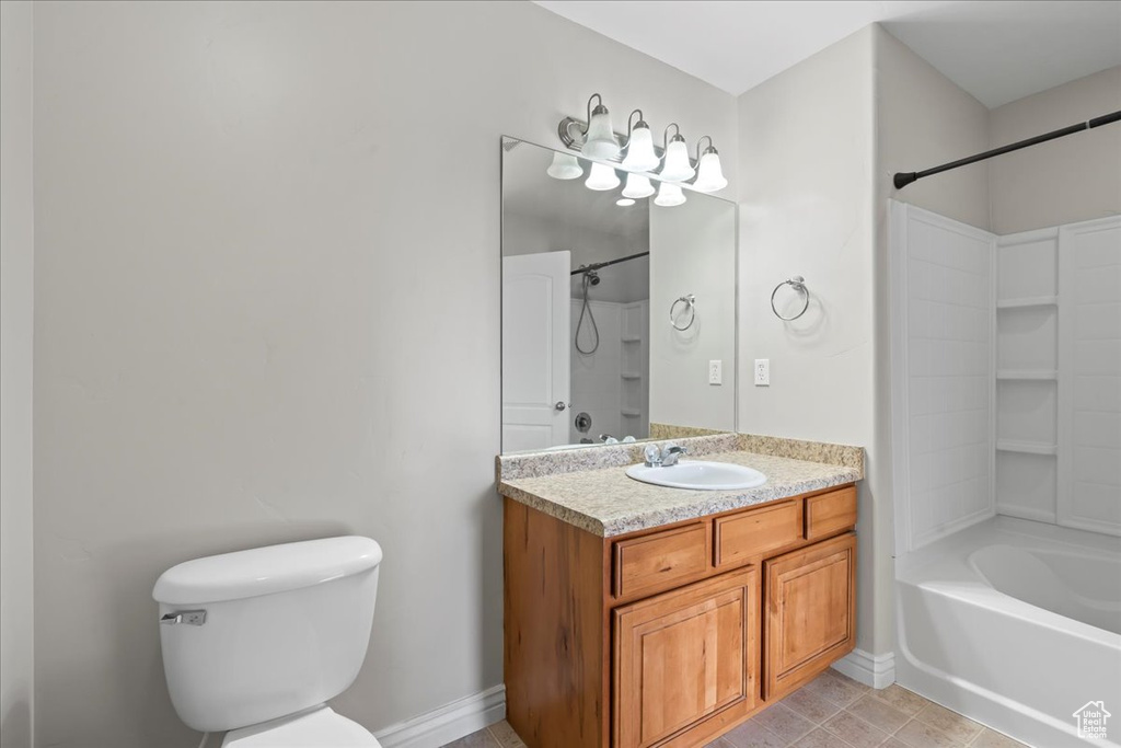 Full bathroom featuring oversized vanity, toilet, bathing tub / shower combination, and tile floors