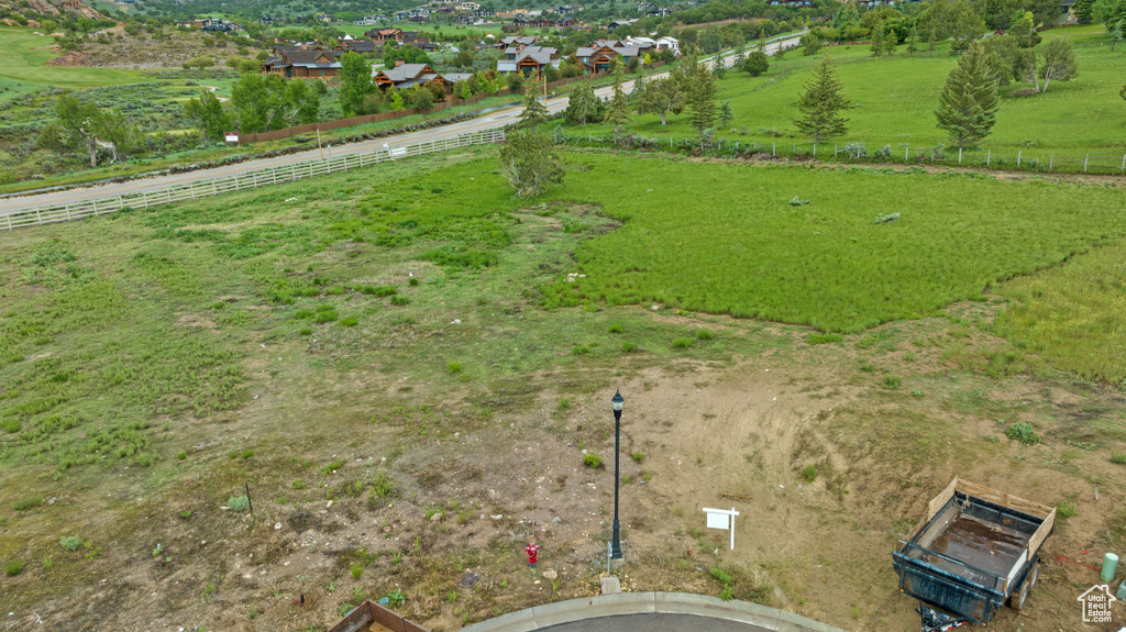 Birds eye view of property with a rural view