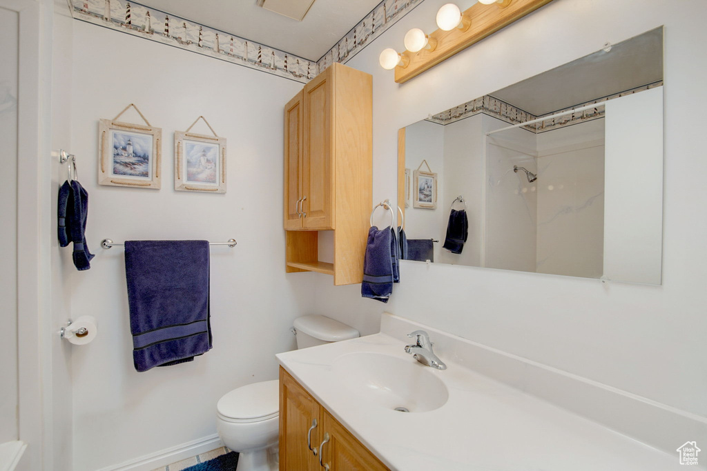 Bathroom with oversized vanity and toilet