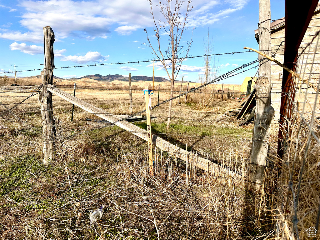 View of yard with a rural view