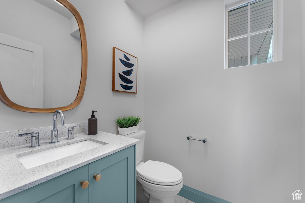 Bathroom with toilet and vanity